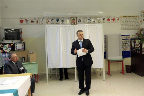 Hungary's Prime Minister Viktor Orban prepares to cast his ballot during parliamentary elections in Budapest April 6, 2014. Hungarians vote Hungary's Prime Minister Viktor Orban prepares to cast his ballot during parliamentary elections in Budapest April 6, 2014. Hungarians vote