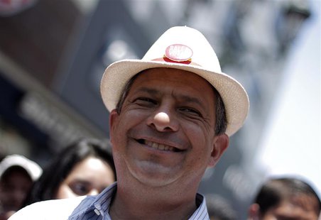 Luis Guillermo Solis, presidential candidate of the Citizens' Action Party (PAC), smiles during a walk in San Jose April 4, 2014. Costa Rica Luis Guillermo Solis, presidential candidate of the Citizens' Action Party (PAC), smiles during a walk in San Jose April 4, 2014. Costa Rica