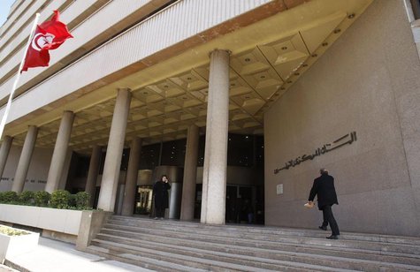 A man walks towards the Central Bank in Tunis December 27, 2013. REUTERS/Zoubeir Souissi A man walks towards the Central Bank in Tunis December 27, 2013. REUTERS/Zoubeir Souissi