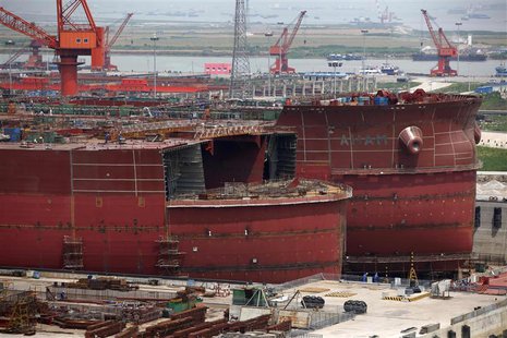Labourers work at a Rongsheng Heavy Industries shipyard in Nantong, Jiangsu province, in this May 21, 2012 file photo. REUTERS/Aly Song/File Labourers work at a Rongsheng Heavy Industries shipyard in Nantong, Jiangsu province, in this May 21, 2012 file photo. REUTERS/Aly Song/File