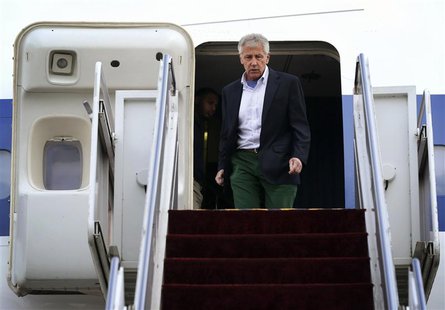 U.S. Defense Secretary Chuck Hagel walks off an aircraft upon his arrival at Yokota Air Force Base in Fussa April 5, 2014. REUTERS/Alex Wong U.S. Defense Secretary Chuck Hagel walks off an aircraft upon his arrival at Yokota Air Force Base in Fussa April 5, 2014. REUTERS/Alex Wong