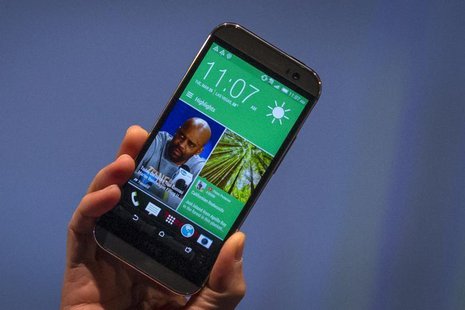 HTC CEO Peter Chou shows the new HTC One M8 phone during a launch event in New York March 25, 2014. REUTERS/Brendan McDermid HTC CEO Peter Chou shows the new HTC One M8 phone during a launch event in New York March 25, 2014. REUTERS/Brendan McDermid