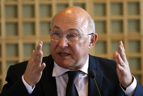 Michel Sapin, France's newly-named Finance Minister and outgoing Labour, Employment and Social Dialogue Minister, delivers a speech during t Michel Sapin, France's newly-named Finance Minister and outgoing Labour, Employment and Social Dialogue Minister, delivers a speech during t