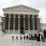Visitors to the Supreme Court are pictured in the rain in Washington, October 7, 2013. REUTERS/Jason Reed Visitors to the Supreme Court are pictured in the rain in Washington, October 7, 2013. REUTERS/Jason Reed