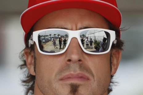 Ferrari Formula One driver Fernando Alonso of Spain arrives at the paddock ahead of the Malaysian F1 Grand Prix at Sepang International Circ Ferrari Formula One driver Fernando Alonso of Spain arrives at the paddock ahead of the Malaysian F1 Grand Prix at Sepang International Circ