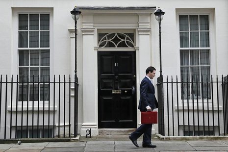 Britain's Chancellor of the Exchequer, George Osborne, walks away from number 11 Downing Street, before delivering his budget to the House o Britain's Chancellor of the Exchequer, George Osborne, walks away from number 11 Downing Street, before delivering his budget to the House o