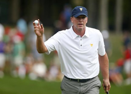 Steve Stricker of the U.S. reacts after sinking a birdie putt on 15 during his match against Ernie Els of South Africa during the Singles ma Steve Stricker of the U.S. reacts after sinking a birdie putt on 15 during his match against Ernie Els of South Africa during the Singles ma