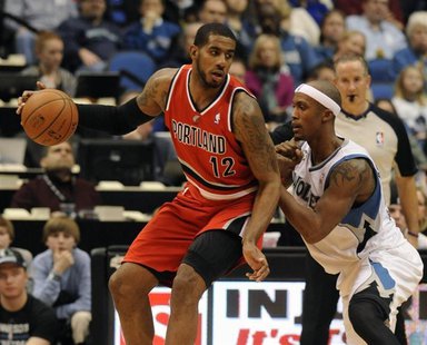 Feb 8, 2014; Minneapolis, MN, USA; Portland Trail Blazers forward LaMarcus Aldridge (12) moves to the basket guarded by Minnesota Timberwolv Feb 8, 2014; Minneapolis, MN, USA; Portland Trail Blazers forward LaMarcus Aldridge (12) moves to the basket guarded by Minnesota Timberwolv