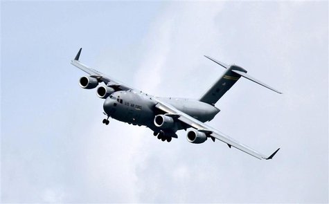 A Boeing C-17 Globemaster III military transport aircraft of the United States Air Force (USAF) performs a fly-by during the Singapore Airsh A Boeing C-17 Globemaster III military transport aircraft of the United States Air Force (USAF) performs a fly-by during the Singapore Airsh