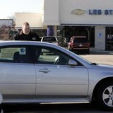 A customer looks at a 2009 Chevrolet Impala sedan at a dealership in Dearborn, Michigan December 29, 2008. REUTERS/Rebecca Cook A customer looks at a 2009 Chevrolet Impala sedan at a dealership in Dearborn, Michigan December 29, 2008. REUTERS/Rebecca Cook
