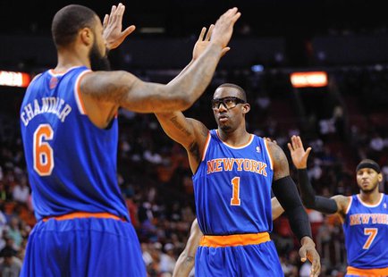 Apr 6, 2014; Miami, FL, USA; New York Knicks forward Amar'e Stoudemire (1) high fives teammate center Tyson Chandler (6) during the first ha Apr 6, 2014; Miami, FL, USA; New York Knicks forward Amar'e Stoudemire (1) high fives teammate center Tyson Chandler (6) during the first ha