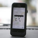 An Uber app is seen on an iPhone in Beverly Hills, California, December 19, 2013. REUTERS/Lucy Nicholson An Uber app is seen on an iPhone in Beverly Hills, California, December 19, 2013. REUTERS/Lucy Nicholson