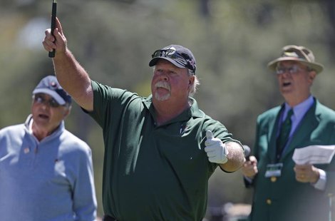 Craig Stadler (C) of the U.S. watches his hole-in-one on the first hole during the Par-3 tournament ahead of the 2011 Masters golf tournamen Craig Stadler (C) of the U.S. watches his hole-in-one on the first hole during the Par-3 tournament ahead of the 2011 Masters golf tournamen