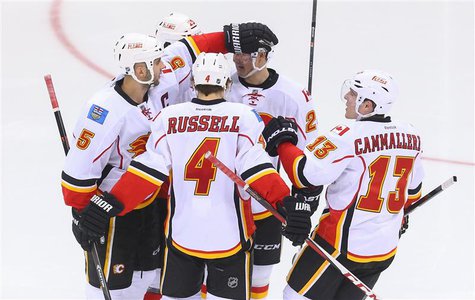 Apr 7, 2014; Newark, NJ, USA; The Calgary Flames celebrate a goal by defenseman Mark Giordano (5) during the third period against the New Je Apr 7, 2014; Newark, NJ, USA; The Calgary Flames celebrate a goal by defenseman Mark Giordano (5) during the third period against the New Je