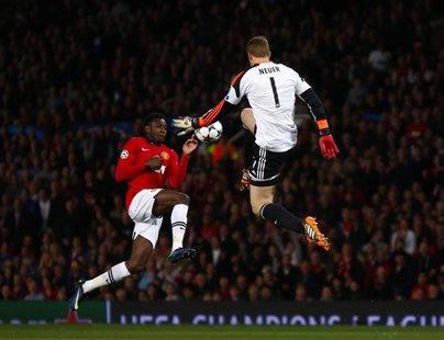 Bayern Munich's Manuel Neuer (R) is challenged by Manchester United's Danny Welbeck during their Champions League quarter-final first leg so Bayern Munich's Manuel Neuer (R) is challenged by Manchester United's Danny Welbeck during their Champions League quarter-final first leg so