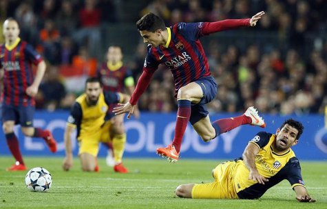 Atletico Madrid's Diego Costa (R) and Barcelona's Marc Bartra fight for the ball during their Champions League quarter-final first leg socce Atletico Madrid's Diego Costa (R) and Barcelona's Marc Bartra fight for the ball during their Champions League quarter-final first leg socce