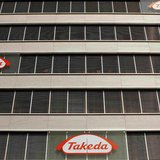Logos of Japanese Takeda Pharmaceutical Co are seen at an office building in Glattbrugg near Zurich, in this March 7, 2012 file photo. REUTE Logos of Japanese Takeda Pharmaceutical Co are seen at an office building in Glattbrugg near Zurich, in this March 7, 2012 file photo. REUTE