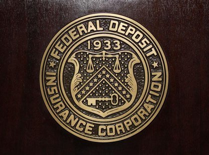 The Federal Deposit Insurance Corp (FDIC) logo is seen at the FDIC headquarters as Chairman Sheila Bair announces the bank and thrift indust The Federal Deposit Insurance Corp (FDIC) logo is seen at the FDIC headquarters as Chairman Sheila Bair announces the bank and thrift indust