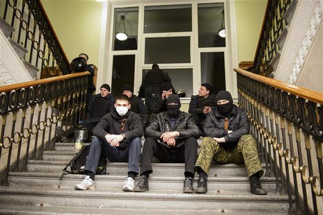 Pro-Russian protesters sit inside the seized regional administrative building in Kharkiv April 6, 2014. REUTERS/Stringer Pro-Russian protesters sit inside the seized regional administrative building in Kharkiv April 6, 2014. REUTERS/Stringer