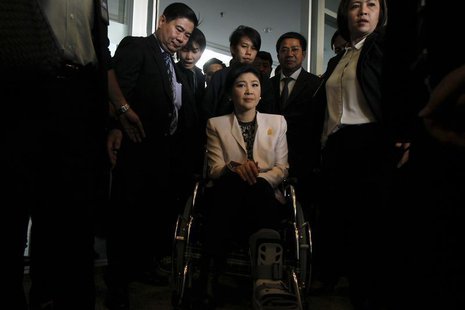 Thai Prime Minister Yingluck Shinawatra leaves the National Anti-Corruption Commission office in Nonthaburi province, on the outskirts of Ba Thai Prime Minister Yingluck Shinawatra leaves the National Anti-Corruption Commission office in Nonthaburi province, on the outskirts of Ba