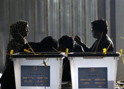 Afghan election workers write numbers on ballot boxes at a counting centre in Kabul April 6, 2014. REUTERS/Mohammad Ismail Afghan election workers write numbers on ballot boxes at a counting centre in Kabul April 6, 2014. REUTERS/Mohammad Ismail