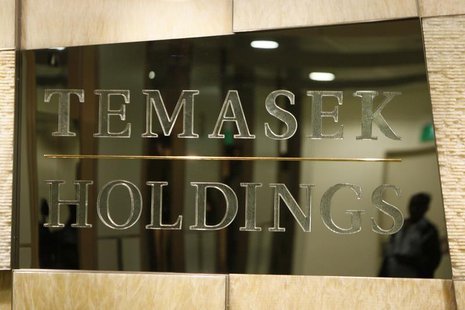 A man is reflected in a Temasek Holdings logo at their offices in Singapore February 6, 2009. REUTERS/Vivek Prakash A man is reflected in a Temasek Holdings logo at their offices in Singapore February 6, 2009. REUTERS/Vivek Prakash
