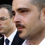 South African Olympic and Paralympic track star Oscar Pistorius (L) arrives to attend his trial at the high court in Pretoria April 8, 2014. South African Olympic and Paralympic track star Oscar Pistorius (L) arrives to attend his trial at the high court in Pretoria April 8, 2014.