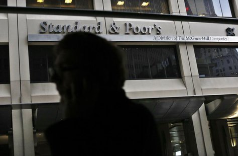 A man walks past the Standard and Poor's building in New York's financial district February 5, 2013. REUTERS/Brendan McDermid A man walks past the Standard and Poor's building in New York's financial district February 5, 2013. REUTERS/Brendan McDermid