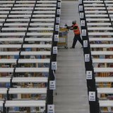 A worker collects orders at Amazon's fulfilment centre in Rugeley, central England December 11, 2012. REUTERS/Phil Noble A worker collects orders at Amazon's fulfilment centre in Rugeley, central England December 11, 2012. REUTERS/Phil Noble