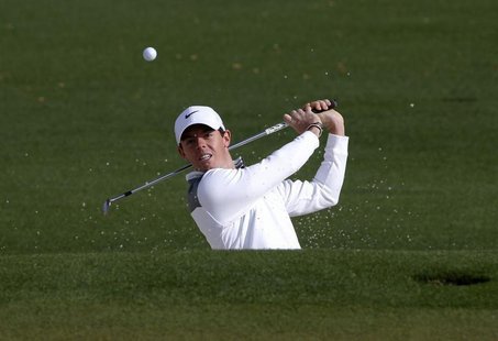 Northern Ireland's Rory McIlroy hits from the sand onto the second green during a practice round ahead of the Masters golf tournament at the Northern Ireland's Rory McIlroy hits from the sand onto the second green during a practice round ahead of the Masters golf tournament at the