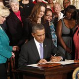 U.S. President Barack Obama signs two new executive actions aimed at increasing transparency about women's pay during an event at the White U.S. President Barack Obama signs two new executive actions aimed at increasing transparency about women's pay during an event at the White
