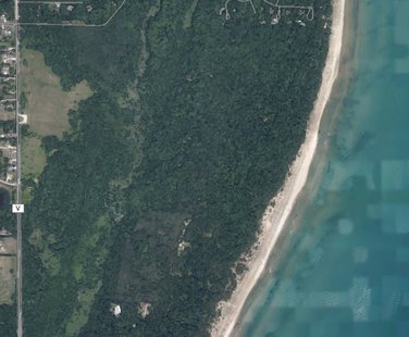 An aerial view of the land owned by Kohler Co. along Lake Michigan in the Town of Wilson that is proposed to be the site of a new golf course. An aerial view of the land owned by Kohler Co. along Lake Michigan in the Town of Wilson that is proposed to be the site of a new golf course.
