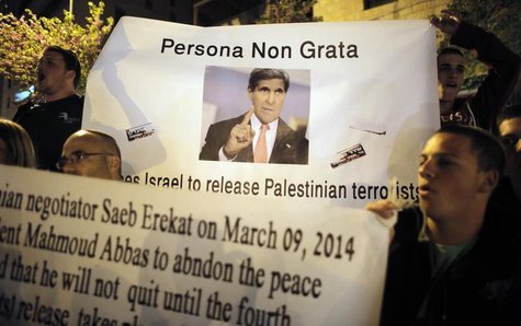 Israelis hold a sign depicting U.S. Secretary of State John Kerry during a protest outside his hotel in Jerusalem, against the release by Is Israelis hold a sign depicting U.S. Secretary of State John Kerry during a protest outside his hotel in Jerusalem, against the release by Is