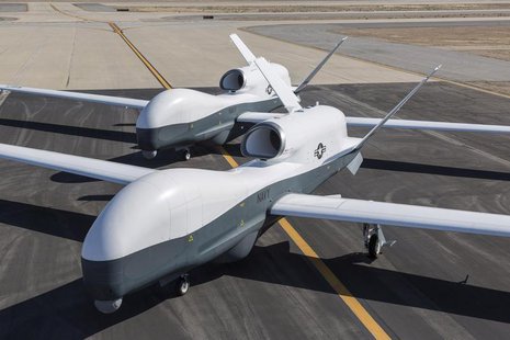 Two Northrop Grumman MQ-4C Triton unmanned aerial vehicles are seen on the tarmac at a Northrop Grumman test facility in Palmdale, Californi Two Northrop Grumman MQ-4C Triton unmanned aerial vehicles are seen on the tarmac at a Northrop Grumman test facility in Palmdale, Californi
