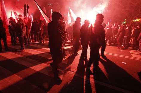 Far-right protesters walk during the annual far-right march, which coincides with Poland's National Independence Day in Warsaw November 11, Far-right protesters walk during the annual far-right march, which coincides with Poland's National Independence Day in Warsaw November 11,