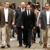 Olympic and Paralympic track star Oscar Pistorius (C) arrives ahead of his trial at the North Gauteng High Court in Pretoria April 9, 2014. Olympic and Paralympic track star Oscar Pistorius (C) arrives ahead of his trial at the North Gauteng High Court in Pretoria April 9, 2014.