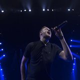 Imagine Dragons lead singer Dan Reynolds performs during the Amnesty International Bringing Human Rights Home concert in the Brooklyn boroug Imagine Dragons lead singer Dan Reynolds performs during the Amnesty International Bringing Human Rights Home concert in the Brooklyn boroug