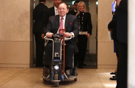 Las Vegas Sands Corp Chairman and Chief Executive Officer Sheldon Adelson rides his wheelchair after a news conference in Tokyo February 24, Las Vegas Sands Corp Chairman and Chief Executive Officer Sheldon Adelson rides his wheelchair after a news conference in Tokyo February 24,