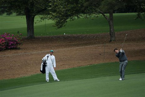 Three time champion Nick Faldo hits on the ninth fairway during a practice round before the Masters golf tournament at the Augusta National Three time champion Nick Faldo hits on the ninth fairway during a practice round before the Masters golf tournament at the Augusta National
