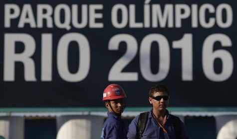 Construction workers on strike stand outside the Rio 2016 Olympic Park construction site in Rio de Janeiro April 8, 2014. REUTERS/Ricardo Mo Construction workers on strike stand outside the Rio 2016 Olympic Park construction site in Rio de Janeiro April 8, 2014. REUTERS/Ricardo Mo