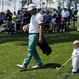 U.S. golfer Ryan Moore and his son Tucker (R) walk along the third hole during the Par 3 contest ahead of the Masters golf tournament at the U.S. golfer Ryan Moore and his son Tucker (R) walk along the third hole during the Par 3 contest ahead of the Masters golf tournament at the