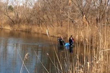 Indiana State Police divers in the water at Lake Charles Indiana State Police divers in the water at Lake Charles
