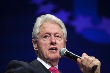 Former U.S. President Bill Clinton begins a discussion for the opening plenary session titled "The Age of Participation" on the first day of Former U.S. President Bill Clinton begins a discussion for the opening plenary session titled "The Age of Participation" on the first day of