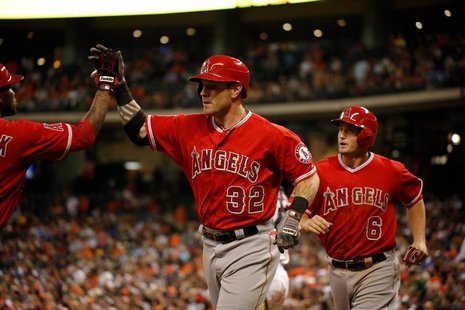 Apr 5, 2014; Houston, TX, USA; Los Angeles Angels left fielder Josh Hamilton (32) high-fives second baseman Howie Kendrick (47) after hittin Apr 5, 2014; Houston, TX, USA; Los Angeles Angels left fielder Josh Hamilton (32) high-fives second baseman Howie Kendrick (47) after hittin