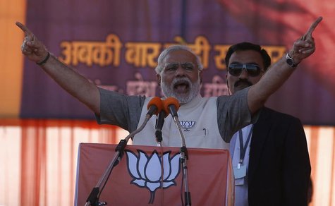 Hindu nationalist Narendra Modi, prime ministerial candidate for the main opposition Bharatiya Janata Party (BJP), gestures as he address a Hindu nationalist Narendra Modi, prime ministerial candidate for the main opposition Bharatiya Janata Party (BJP), gestures as he address a