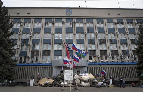 A barricade is set up in front of the seized SBU state security service in Luhansk, in eastern Ukraine April 10, 2014. REUTERS/Shamil Zhumat A barricade is set up in front of the seized SBU state security service in Luhansk, in eastern Ukraine April 10, 2014. REUTERS/Shamil Zhumat