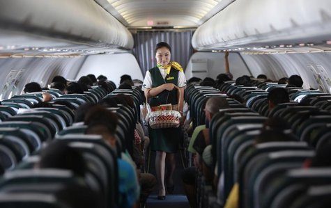 A Spring Airlines crew member sells food onboard an Airbus A320 aircraft near Shanghai July 6, 2012. REUTERS/Aly Song A Spring Airlines crew member sells food onboard an Airbus A320 aircraft near Shanghai July 6, 2012. REUTERS/Aly Song