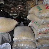 A worker carries a sack of soybeans at a food wholesale market in Shenyang, Liaoning province January 13, 2011. REUTERS/Sheng Li A worker carries a sack of soybeans at a food wholesale market in Shenyang, Liaoning province January 13, 2011. REUTERS/Sheng Li