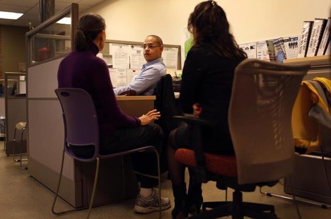 Fifty-four-years-old Natalia Pollack (L), uninsured since 1999, is helped to sign up for health insurance through the Affordable Care Act, a Fifty-four-years-old Natalia Pollack (L), uninsured since 1999, is helped to sign up for health insurance through the Affordable Care Act, a