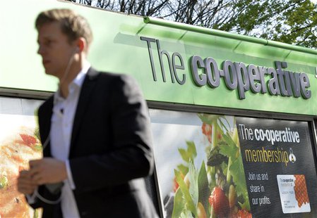 A pedestrian passes a Co-operative retail store in east London, April 10, 2014. REUTERS/Toby Melville A pedestrian passes a Co-operative retail store in east London, April 10, 2014. REUTERS/Toby Melville